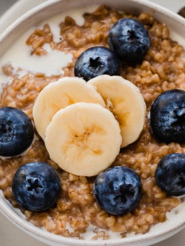 Steel cut oats with bananas and fresh blueberries.