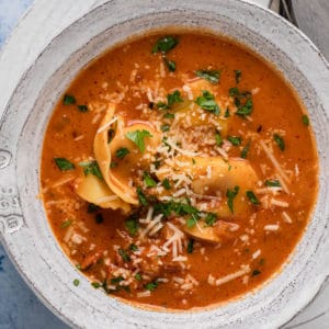 A bowl of tortellini soup.