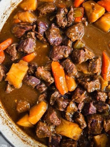 guinness beef stew in a dutch oven.
