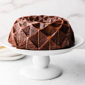 guinness chocolate cake on a white stand