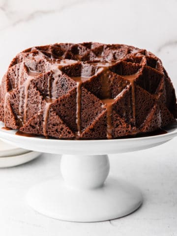 guinness chocolate cake on a white stand