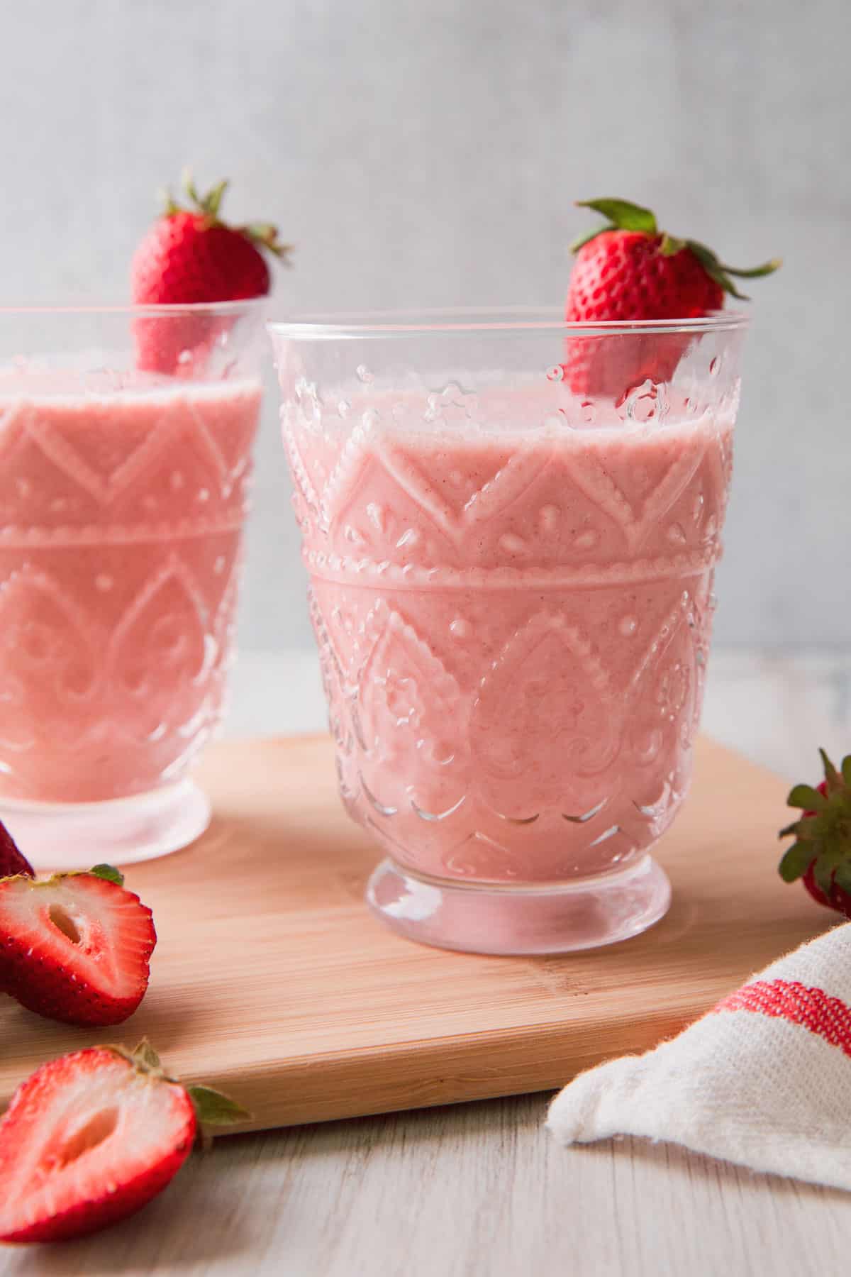 a pink smoothie in a glass