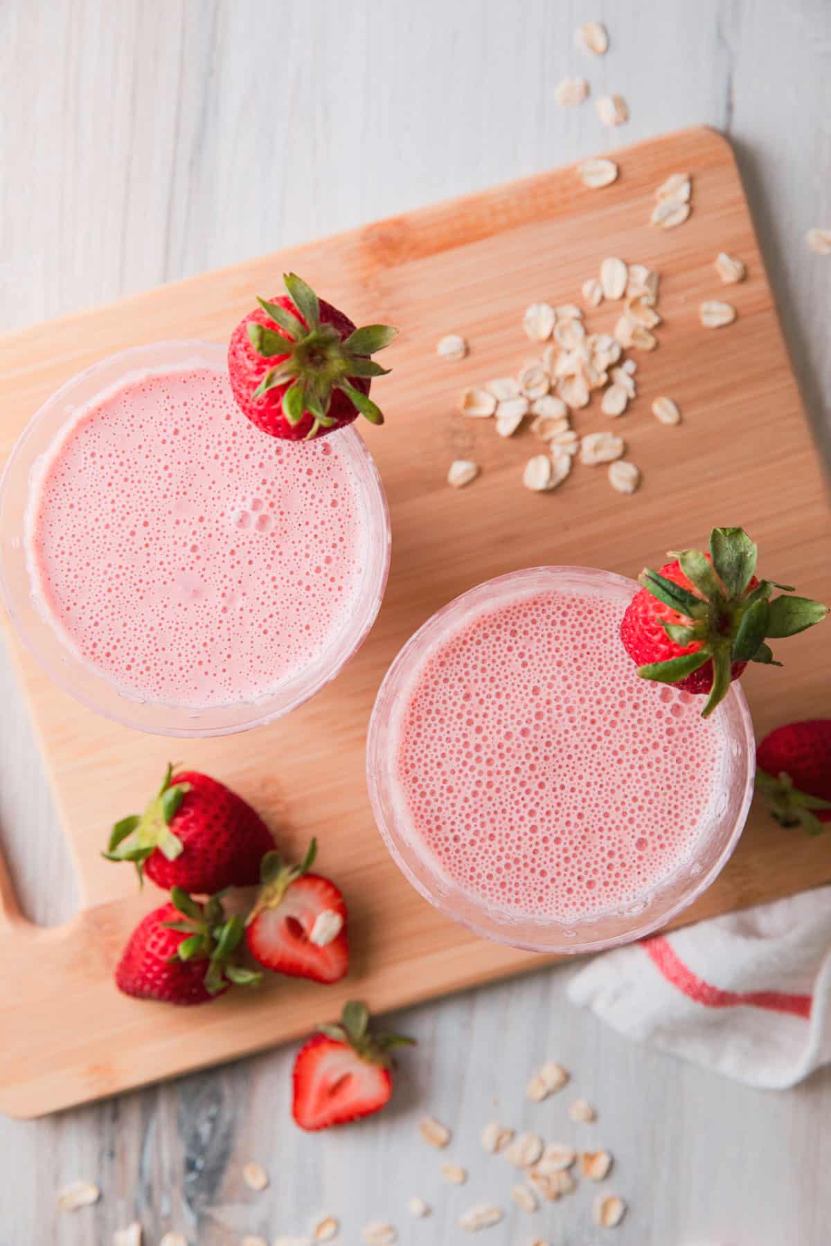 2 glasses with  pink smoothie 
