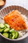 salmon over rice and cucumbers