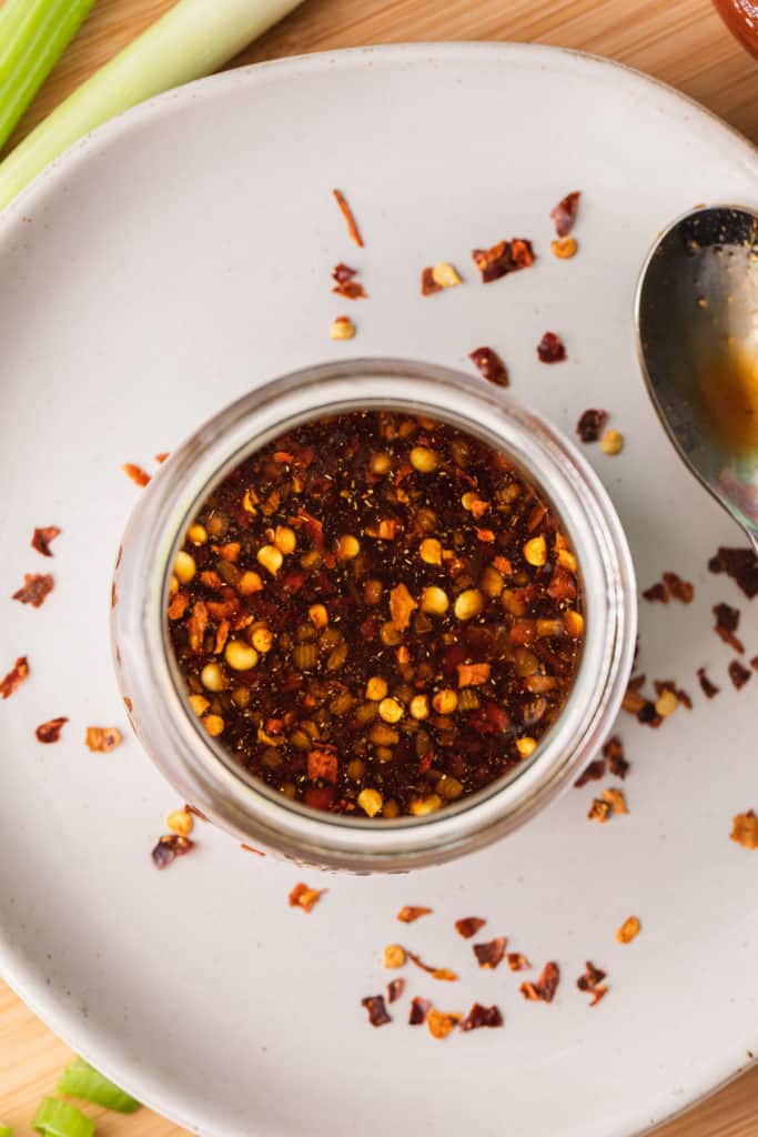 red pepper sauce in a glass jar