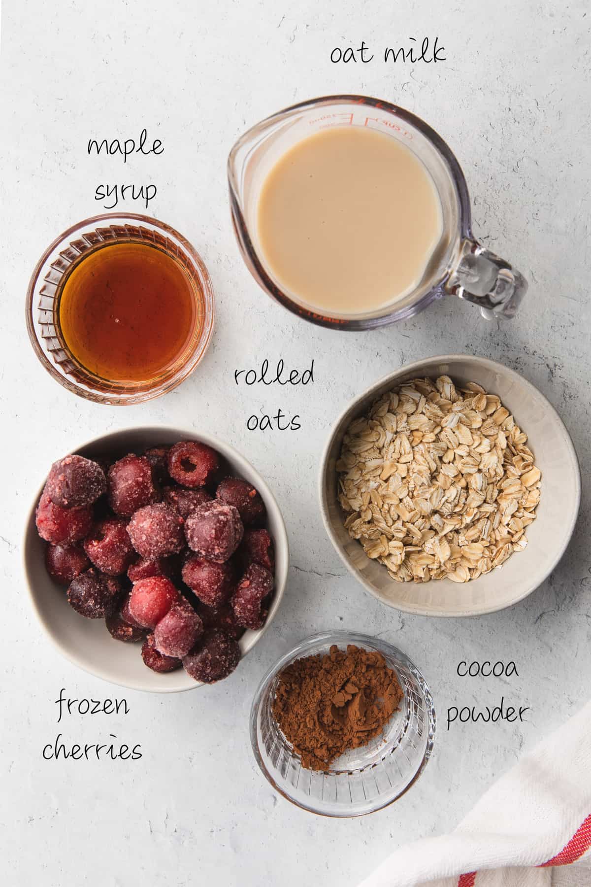 ingredients to make chocolate cherry smoothie on the countertop