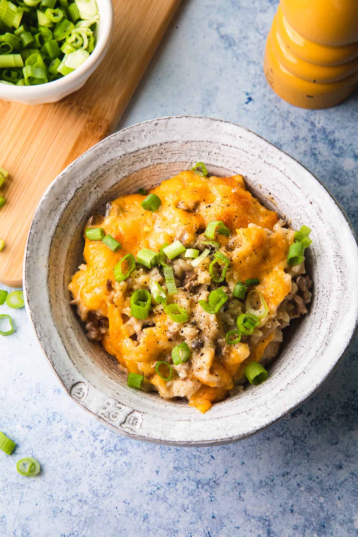 cheesy casserole in a white bowl 