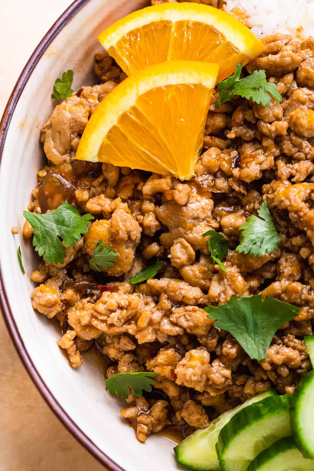 ground orange chicken in a bowl