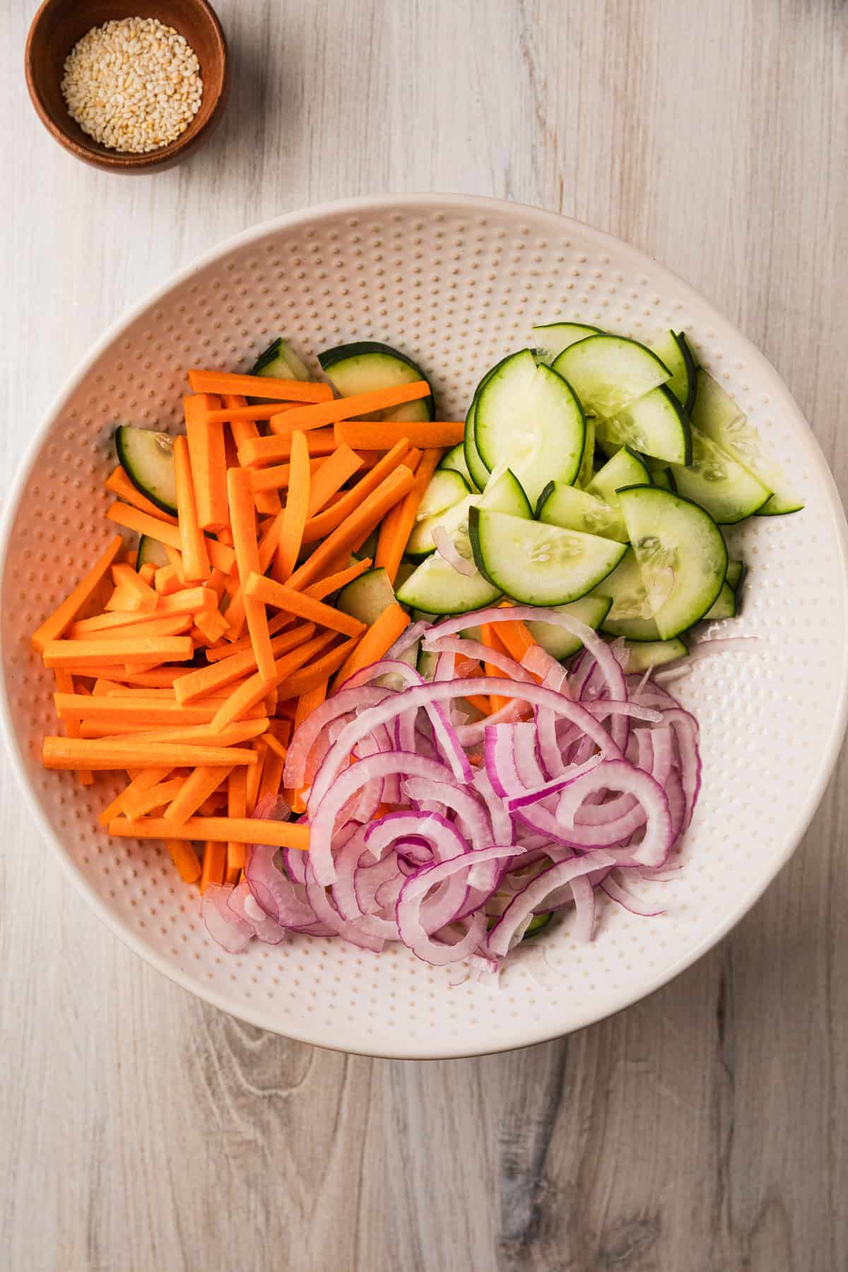 salad ingredients separated in a bowl.