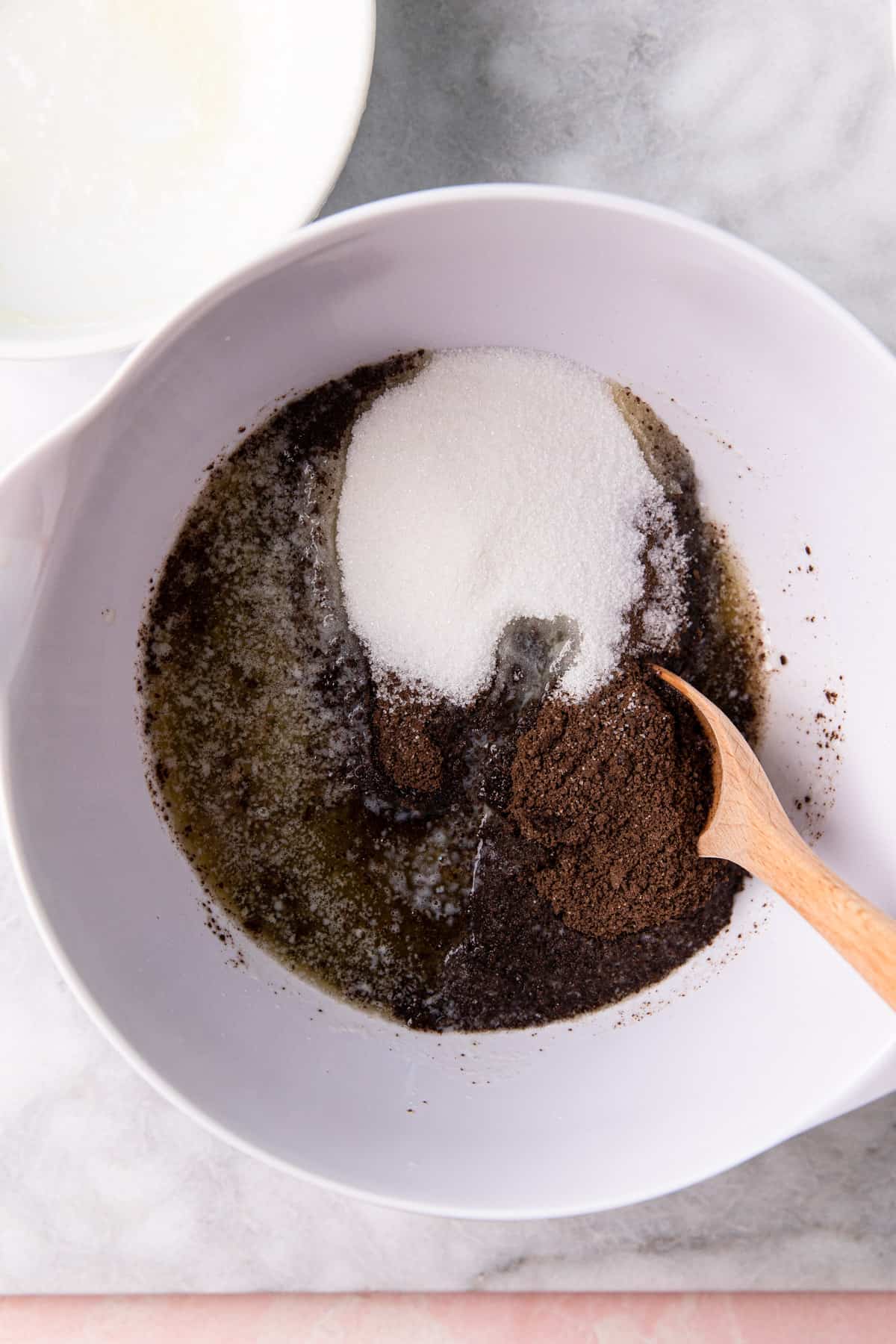 Chocolate graham cracker crumbs in a mixing bowl.