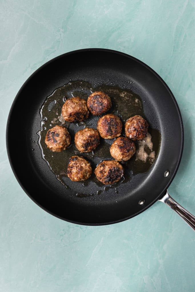 Meatballs in a fry pan.