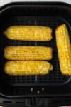 cooked corn on the cob in an air fryer basket