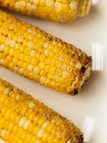 Corn on the cob with crispy edges.