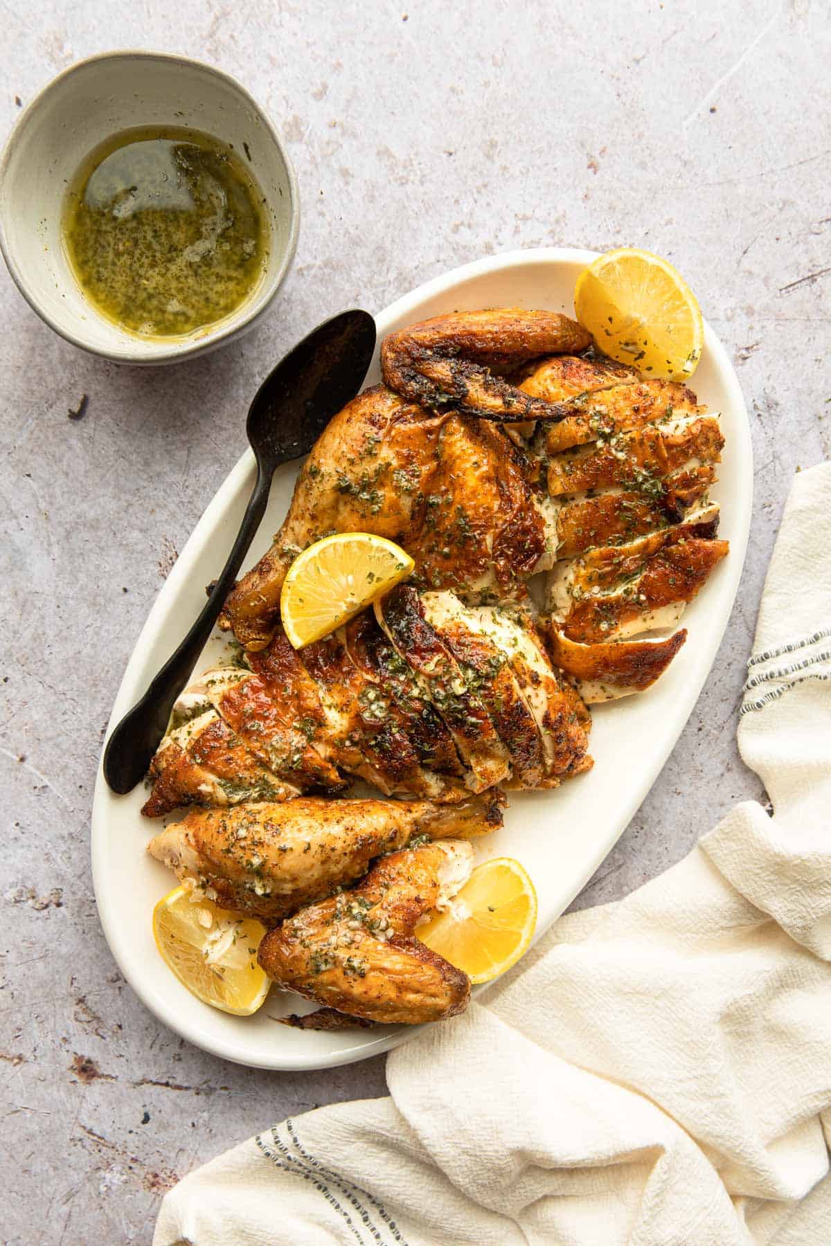 a platter of cut up cooked chicken