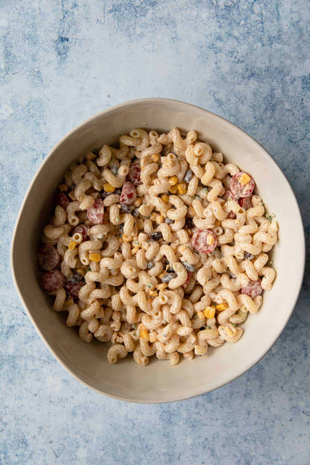 a bowl of mixed pasta salad