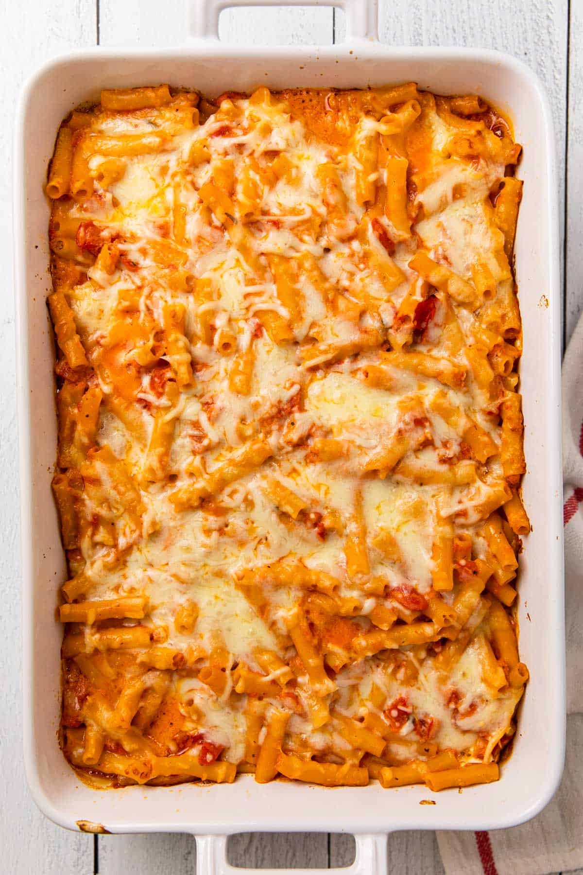 a dish with a baked pasta dish covered in melted cheese