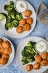 several plates of meatballs and broccoli