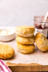 biscuits stacked up with jam in the background