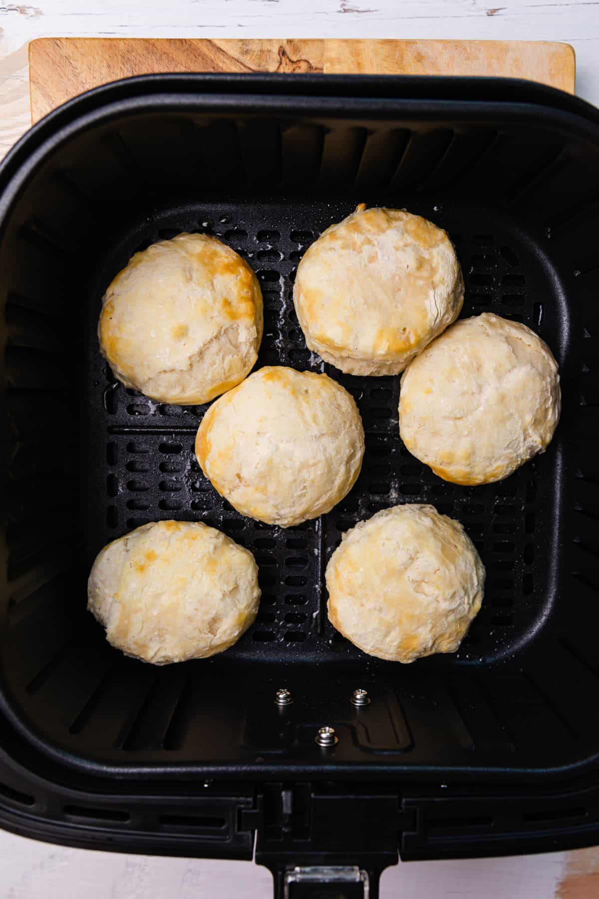 Frozen biscuits cooked halfway.