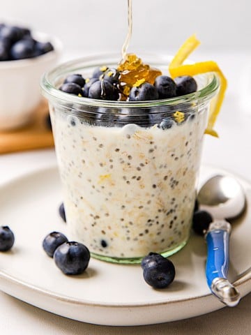 overnight oats in a glass jar with honey drizzle
