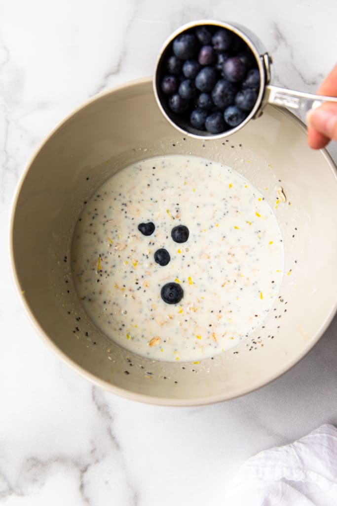 adding blueberries to milk mixture