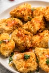 chicken bites with hot sauce a plate