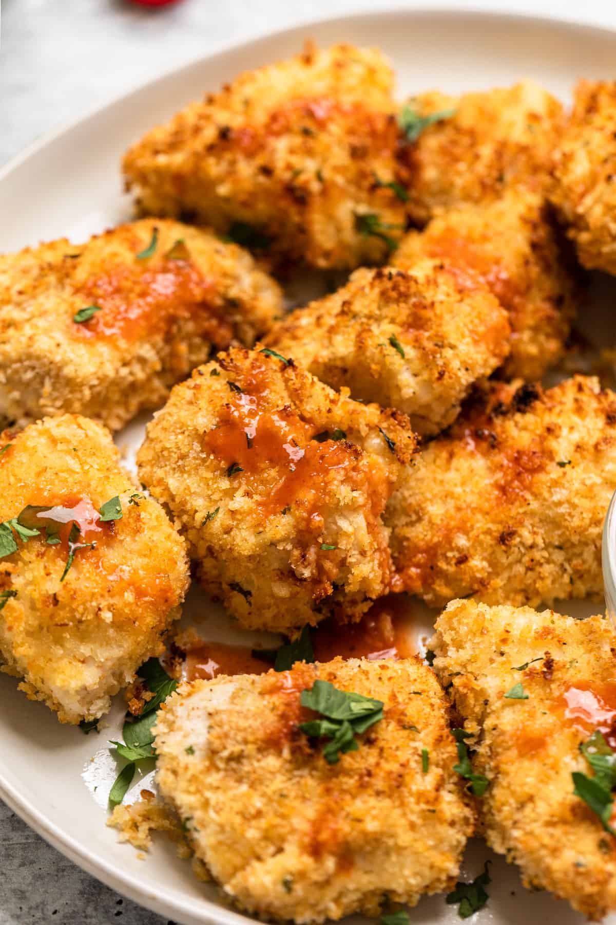 chicken bites with hot sauce a plate 