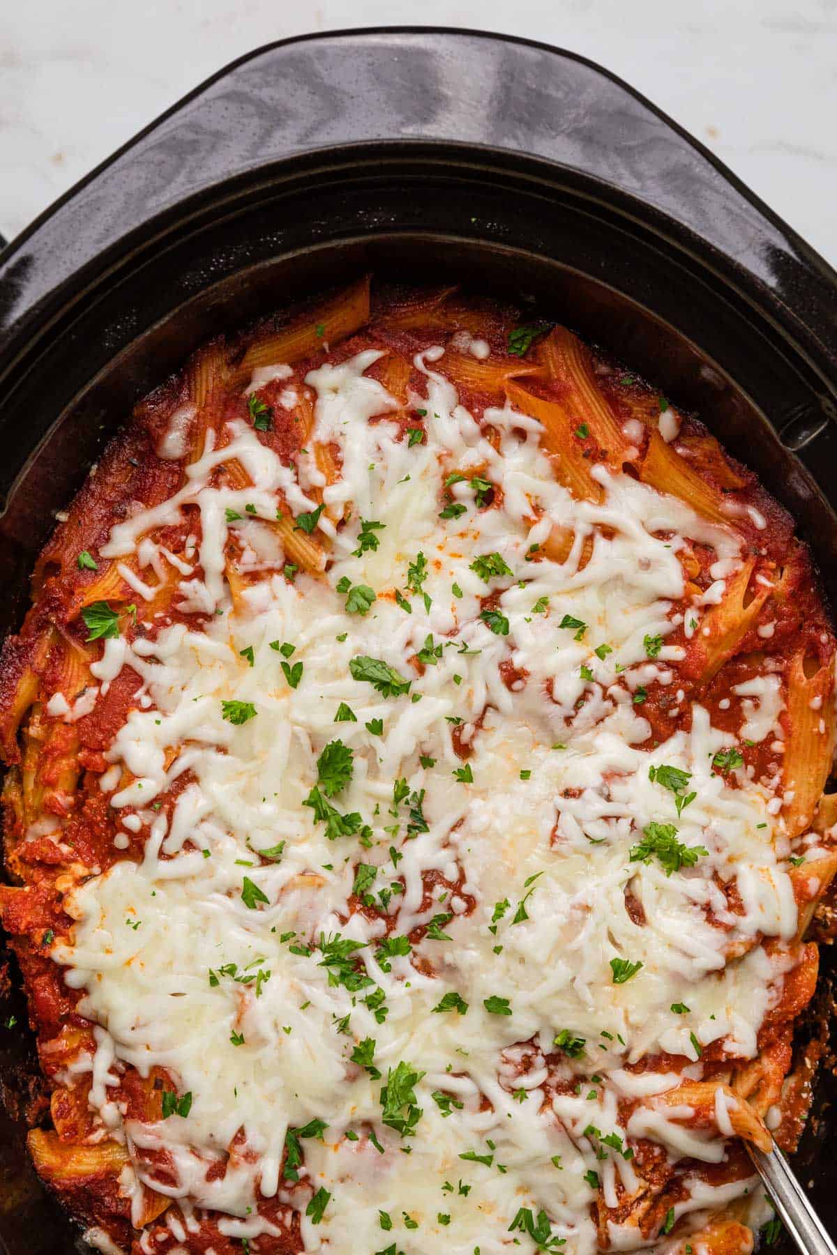 slow cooker filled with baked ziti