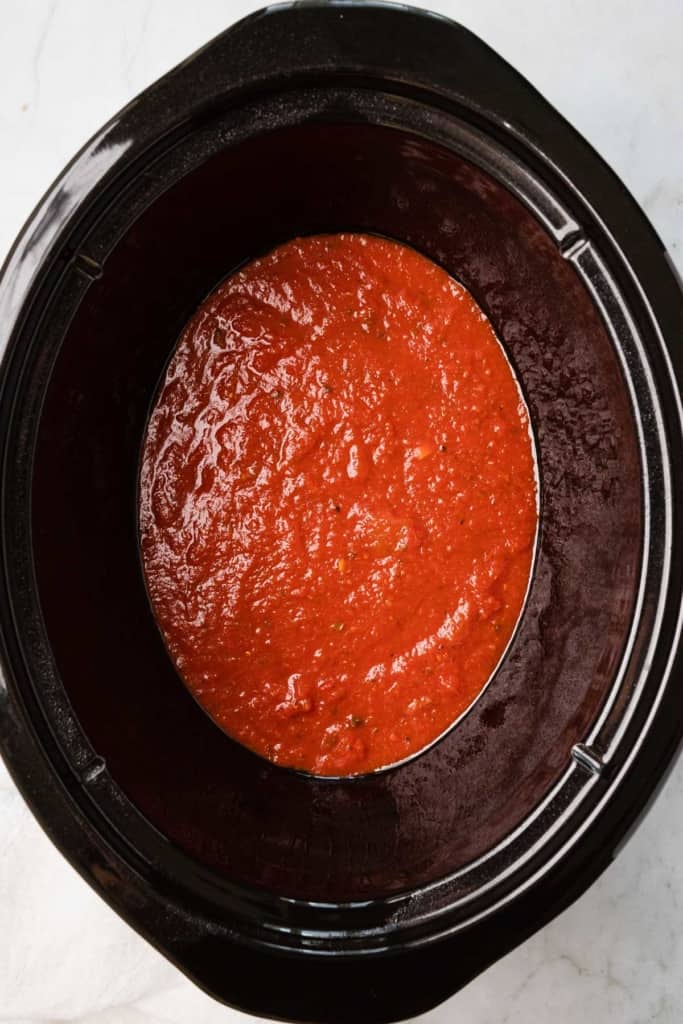 tomato sauce in the bottom of crockpot