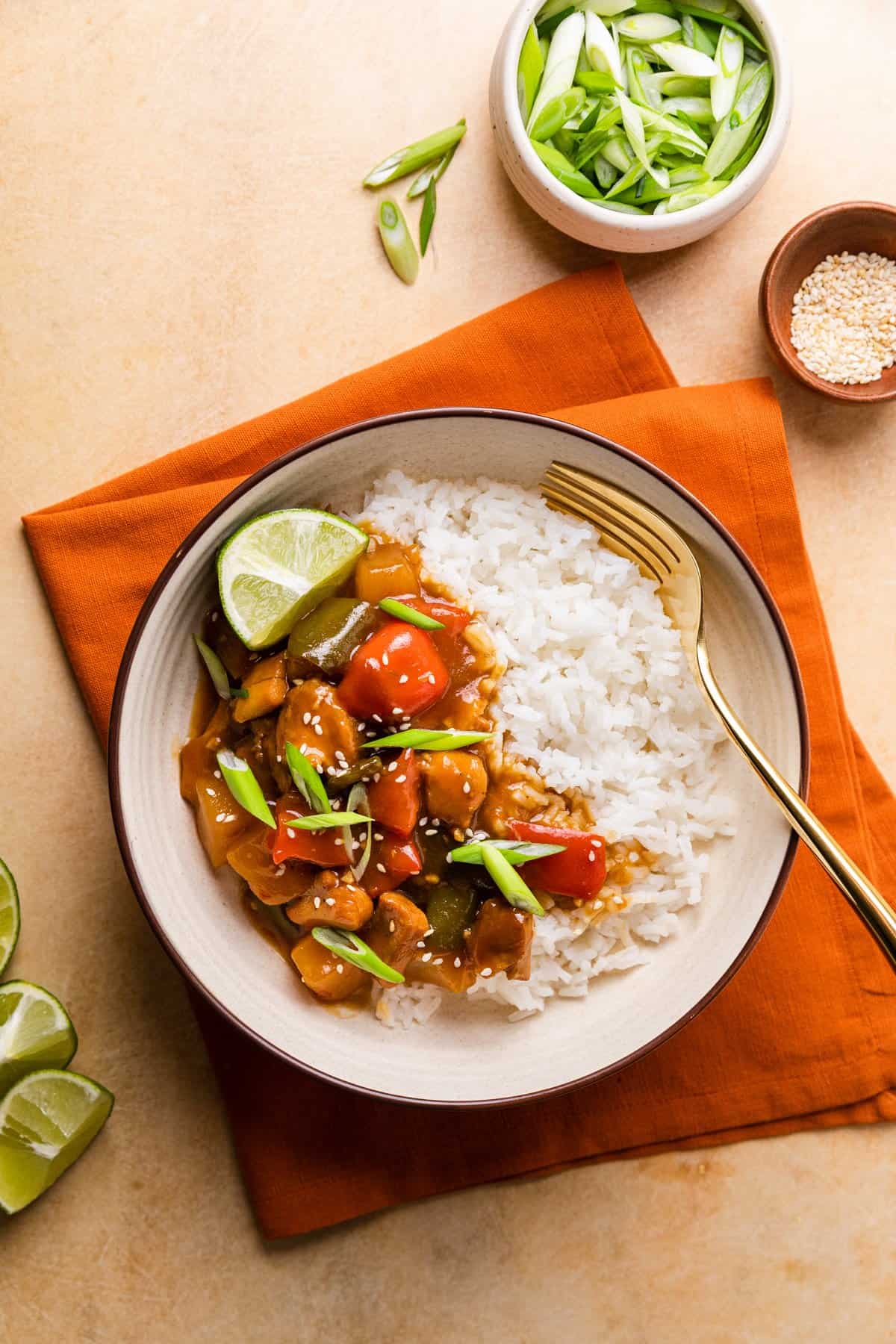 the finished recipe in a bowl with green onions on the side