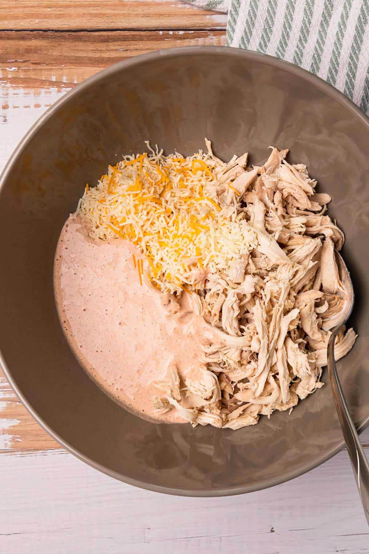 Add chicken, salsa, and cheese to bowl