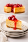 the complete air fryer cheesecake topped with strawberry sauce