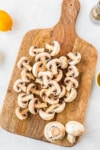 sliced mushrooms on a cutting board