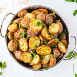 roasted red potatoes in a bowl sprinkled with parsley
