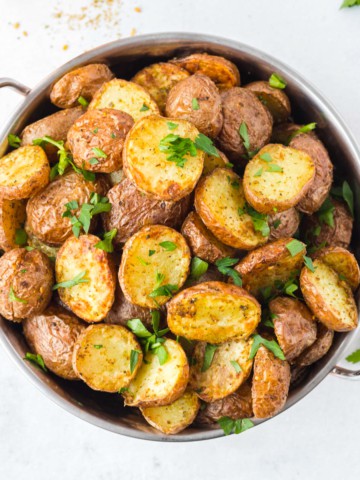 roasted red potatoes in a bowl sprinkled with parsley