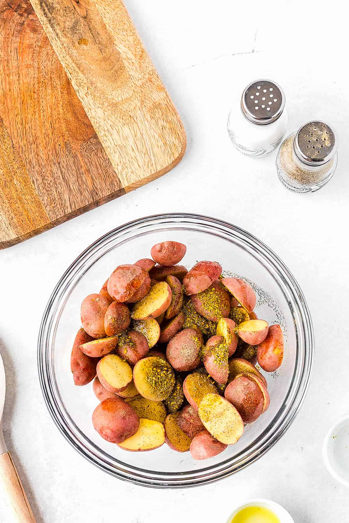 Red potatoes mixed oil and seasonings