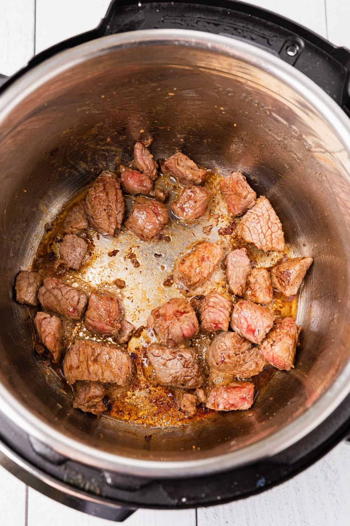 beef chunks being cooked