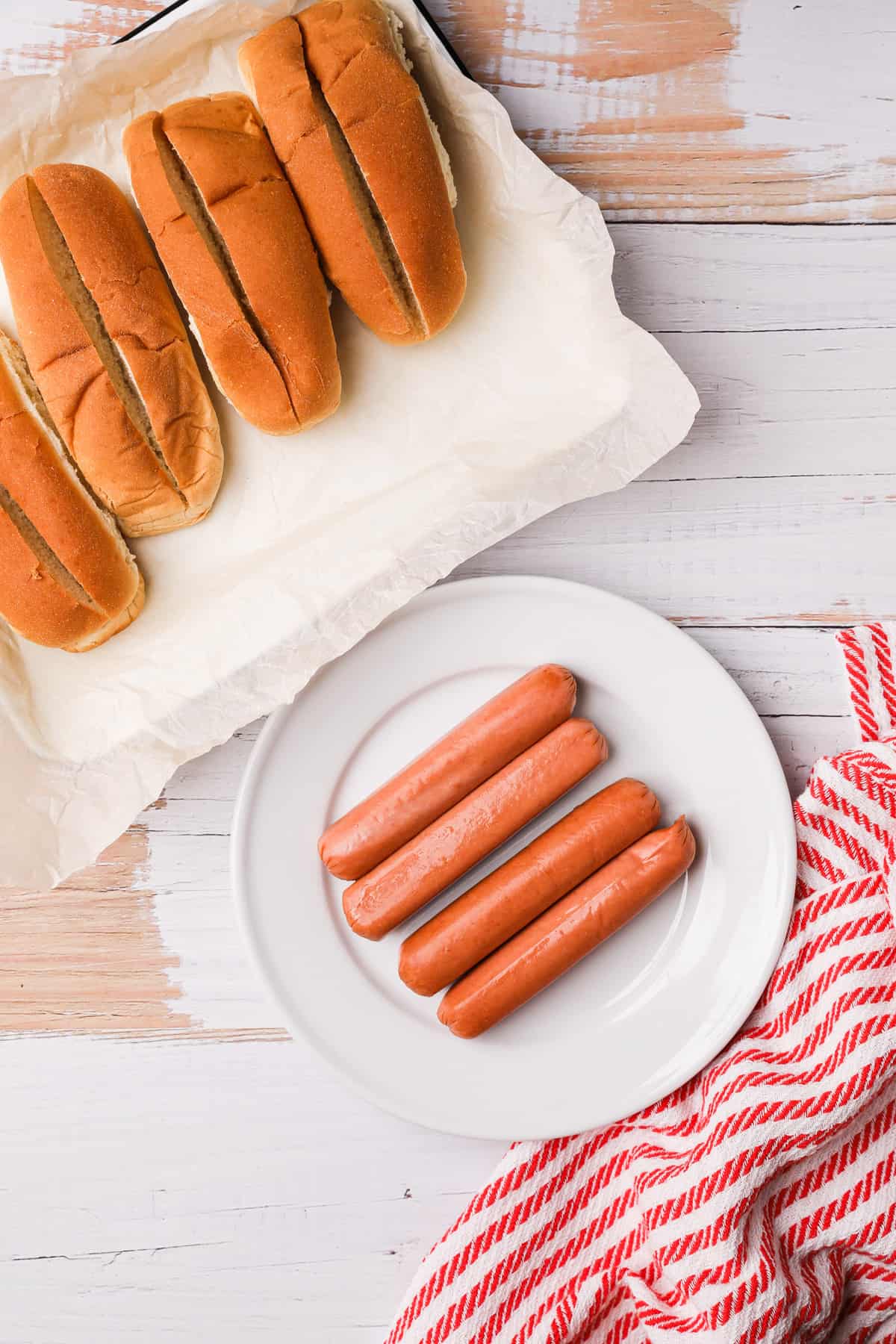 uncooked hot dogs and buns