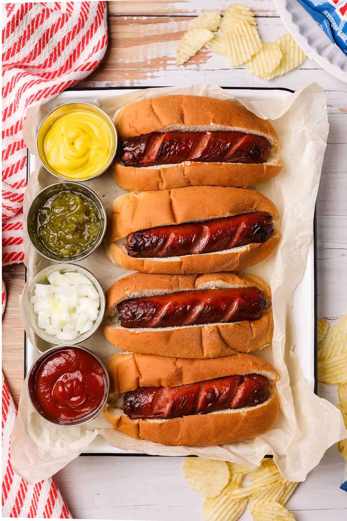 prepared hot dogs with condiments on the side