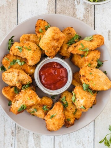 a plate of chicken nuggets