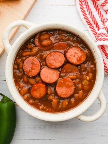baked beans mixed with sliced sausage
