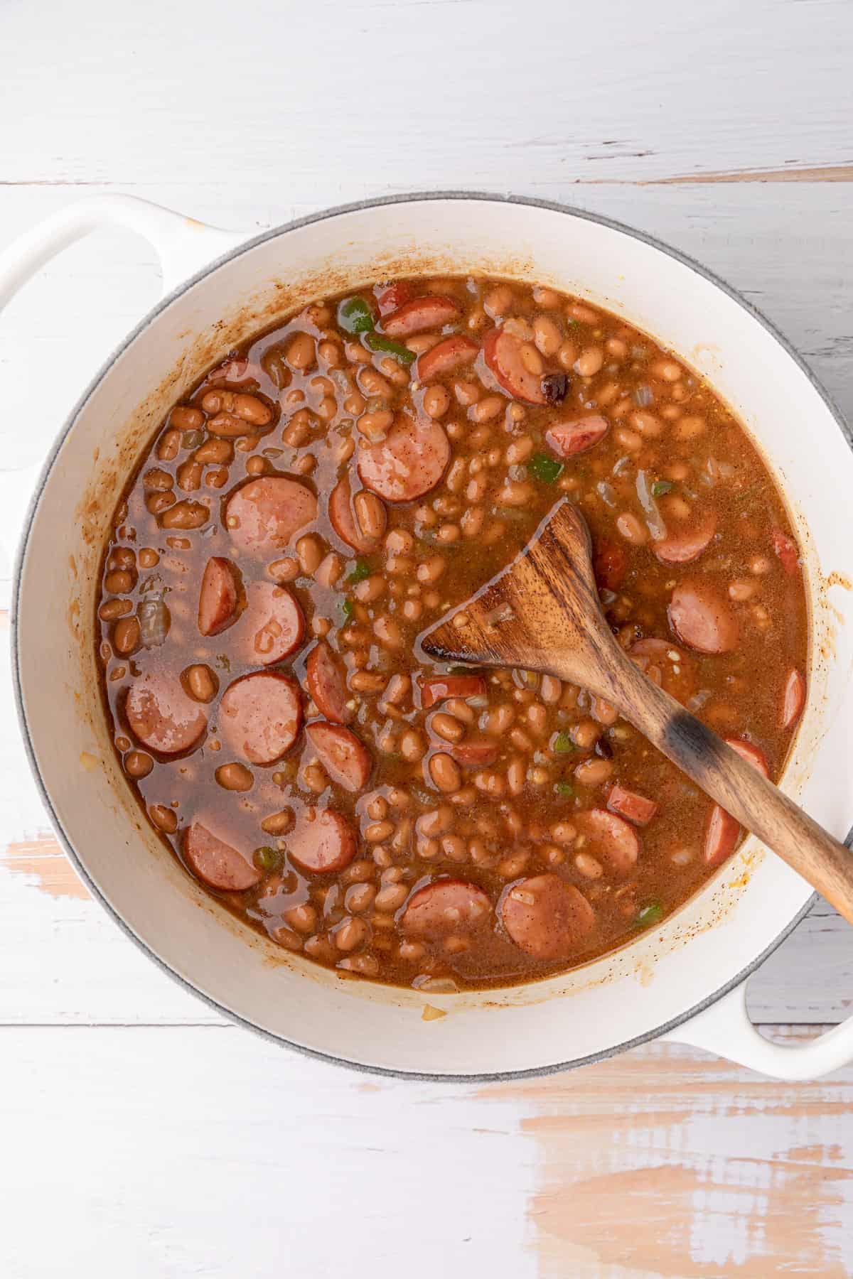 stirring a pot of baked beans