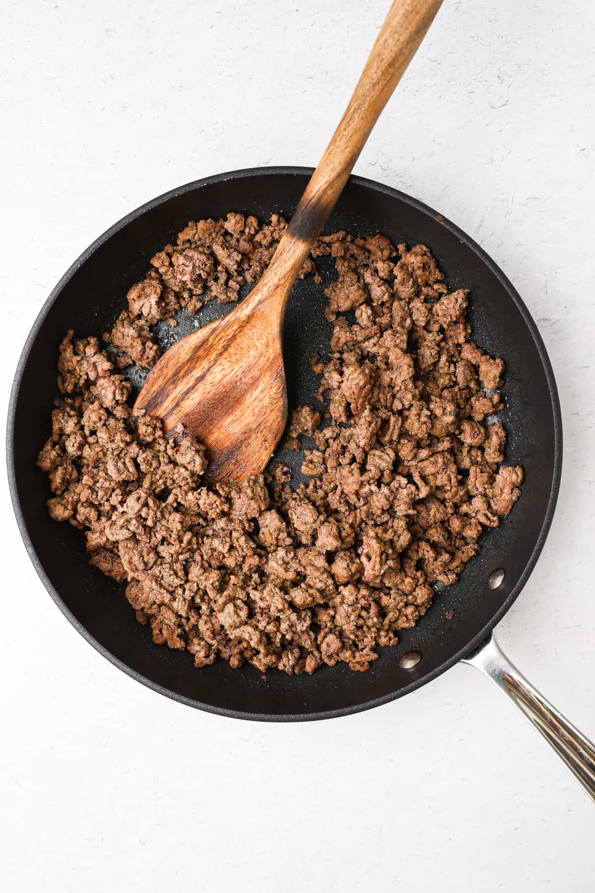 Cooking ground beef in a skillet.