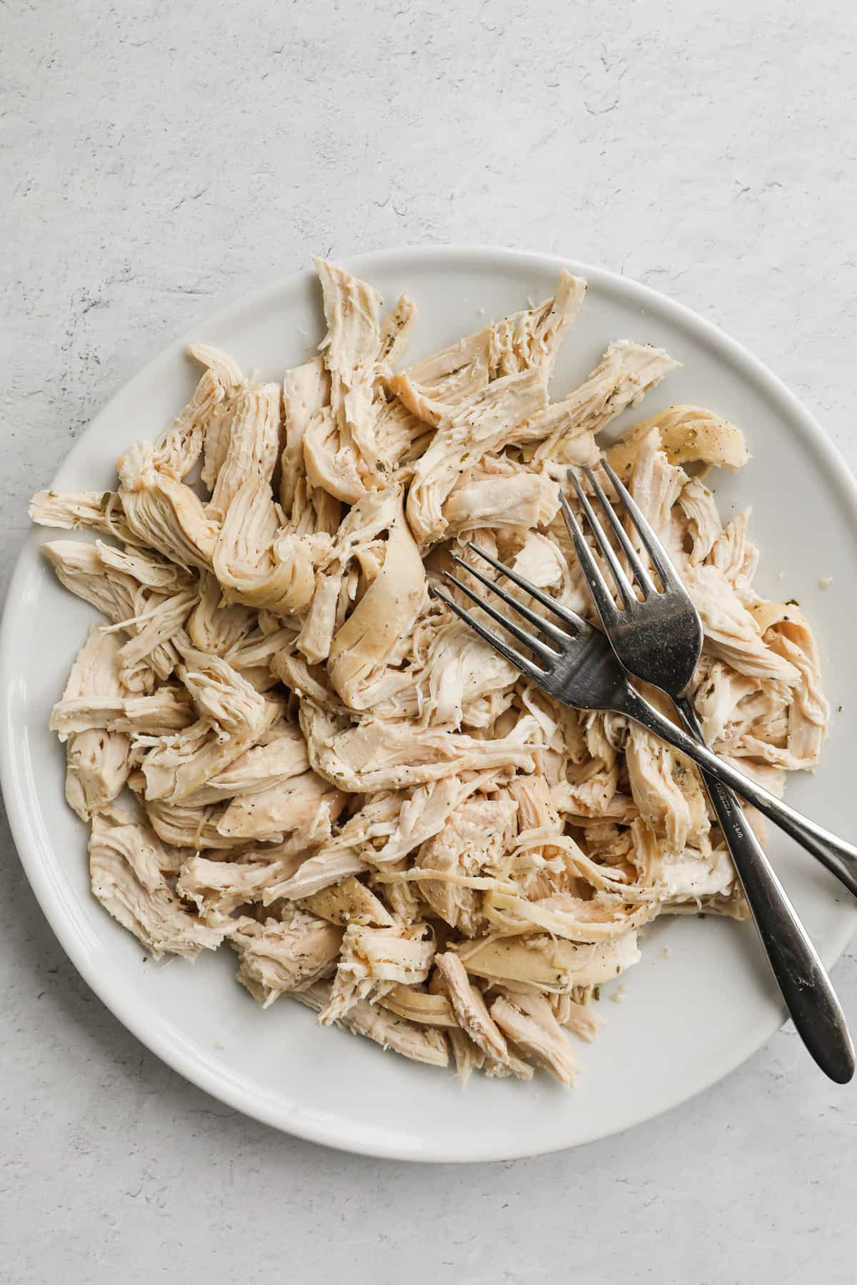 shredded cooked chicken on a plate