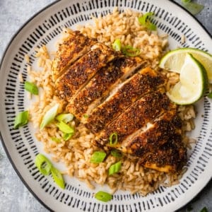 air fryer blackened chicken on a plate with rice