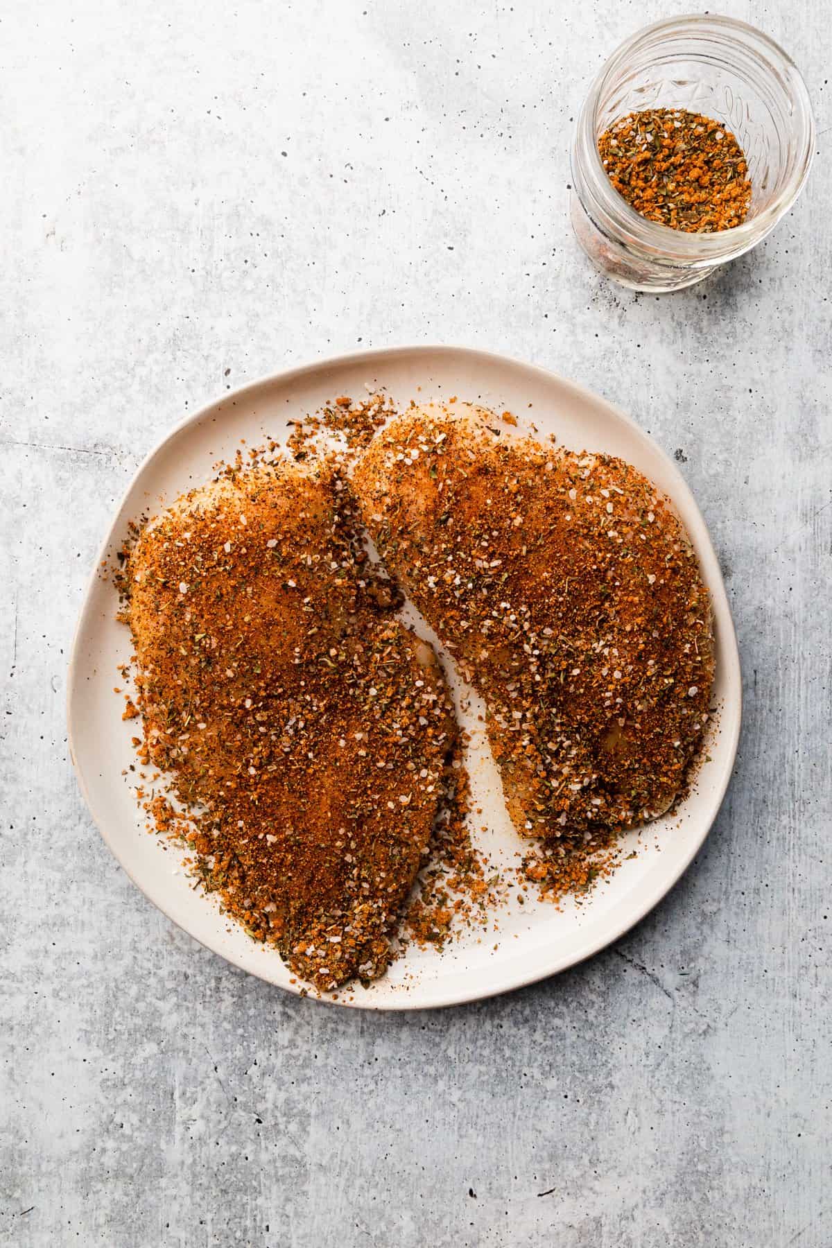 seasoning covering chicken breasts