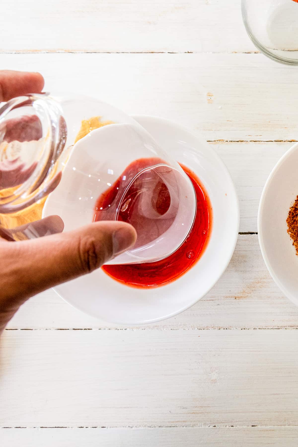 dipping glass rim into chamoy sauce