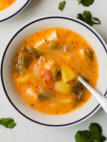 the complete caldo de queso recipe served in a bowl