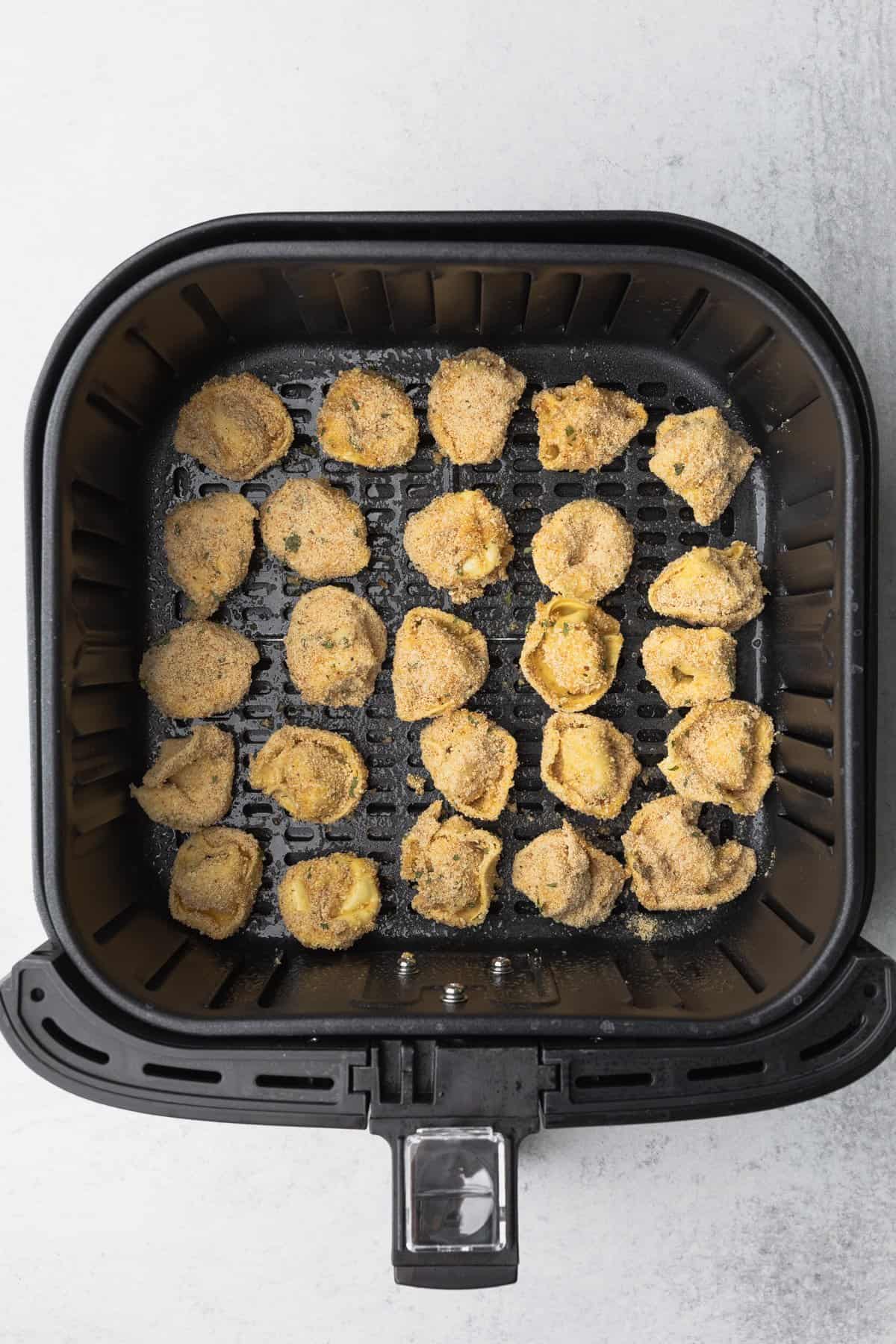 tortellini in the air fryer basket in a single layer