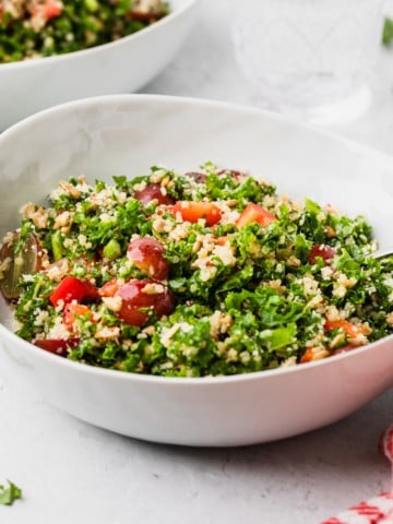 kale salad copycat recipe in a white salad bowl